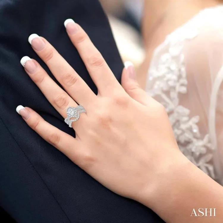 1 1/2 Ctw Diamond Wedding Set With 1 1/5 Ctw Pear Shape Intertwined Engagement Ring and 1/4 Ctw Wedding Band in 14K White Gold